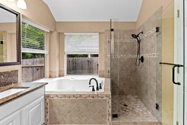 13121 Armaga Springs Rd, Austin, TX 78727 - full bath featuring vanity, a shower stall, a bath, and vaulted ceiling