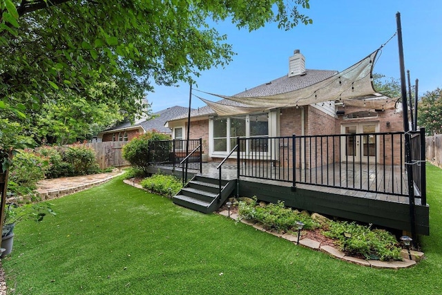 13121 Armaga Springs Rd, Austin, TX 78727 - back of property with brick siding, a wooden deck, and a chimney