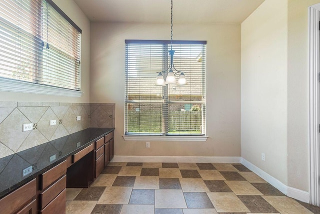 2713 Windy Vane Dr, Pflugerville, TX 78660 - unfurnished dining area featuring plenty of natural light and a chandelier