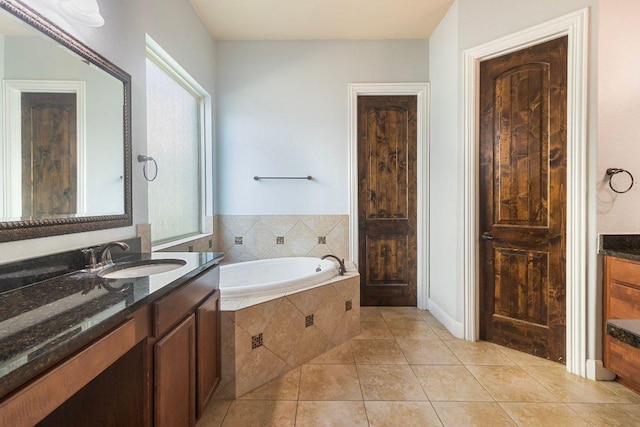 2713 Windy Vane Dr, Pflugerville, TX 78660 - bathroom with vanity, a bath, and tile patterned flooring