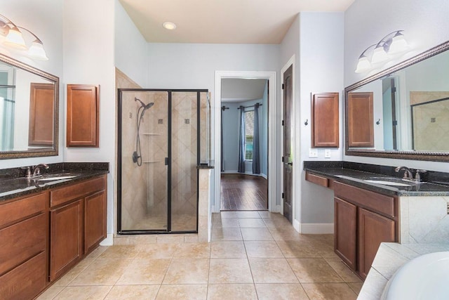2713 Windy Vane Dr, Pflugerville, TX 78660 - bathroom with a shower stall, two vanities, tile patterned floors, and a tub to relax in