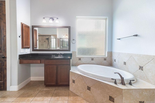 2713 Windy Vane Dr, Pflugerville, TX 78660 - bathroom featuring a garden tub, a shower stall, vanity, and tile patterned floors