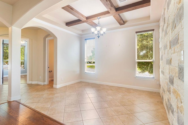 2713 Windy Vane Dr, Pflugerville, TX 78660 - spare room with coffered ceiling, beam ceiling, arched walkways, a chandelier, and light tile patterned flooring