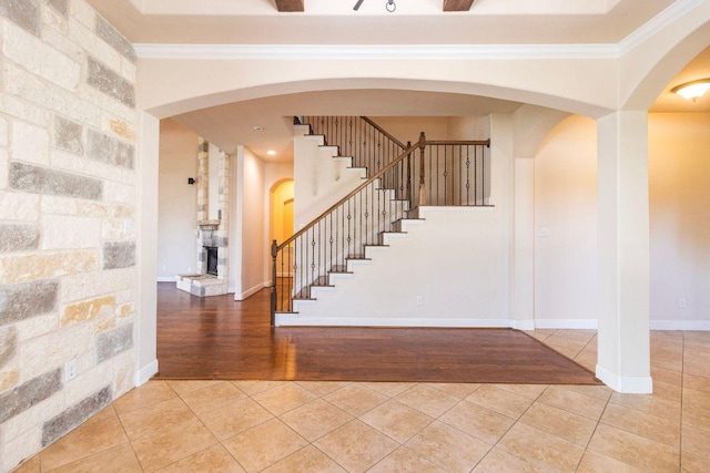 2713 Windy Vane Dr, Pflugerville, TX 78660 - stairs featuring tile patterned flooring, arched walkways, and ornamental molding