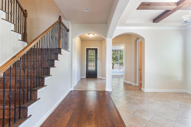 2713 Windy Vane Dr, Pflugerville, TX 78660 - entryway with arched walkways, stairway, tile patterned flooring, and beam ceiling