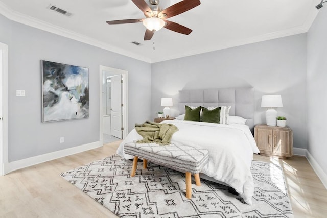 6715 Windrift Way Unit 29, Austin, TX 78745 - bedroom featuring light wood-style floors, crown molding, a ceiling fan, and ensuite bathroom