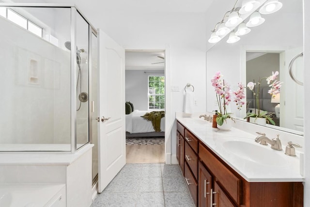 6715 Windrift Way Unit 29, Austin, TX 78745 - bathroom featuring connected bathroom, double vanity, and a shower stall
