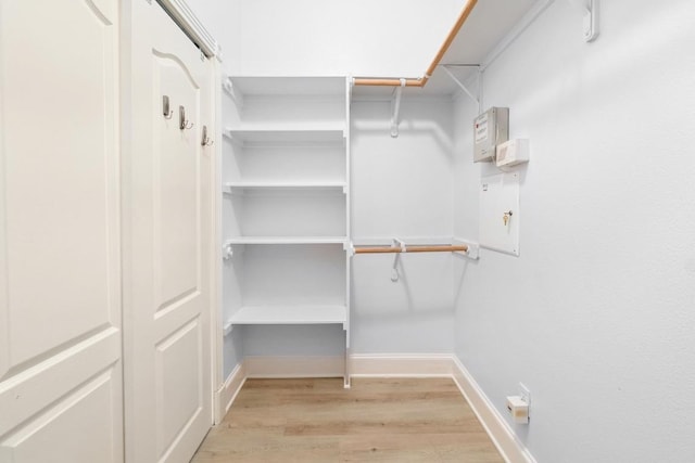 6715 Windrift Way Unit 29, Austin, TX 78745 - walk in closet featuring light wood-type flooring