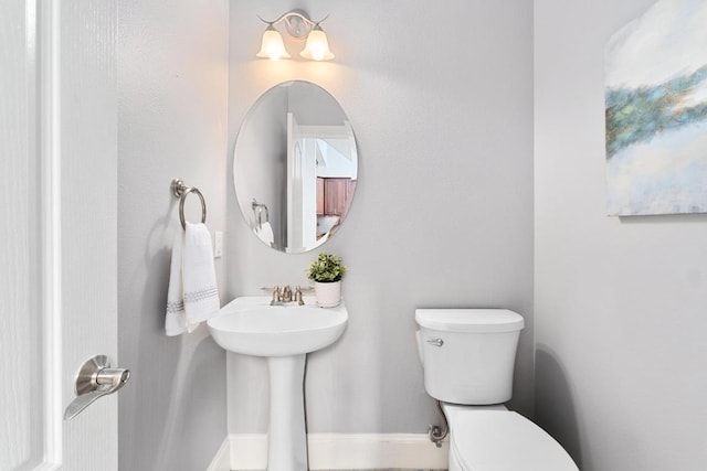 6715 Windrift Way Unit 29, Austin, TX 78745 - bathroom with toilet and a sink