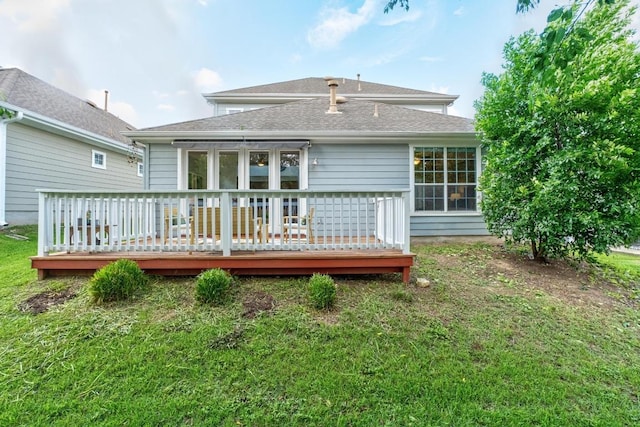 6715 Windrift Way Unit 29, Austin, TX 78745 - rear view of house featuring a wooden deck, roof with shingles, and a yard