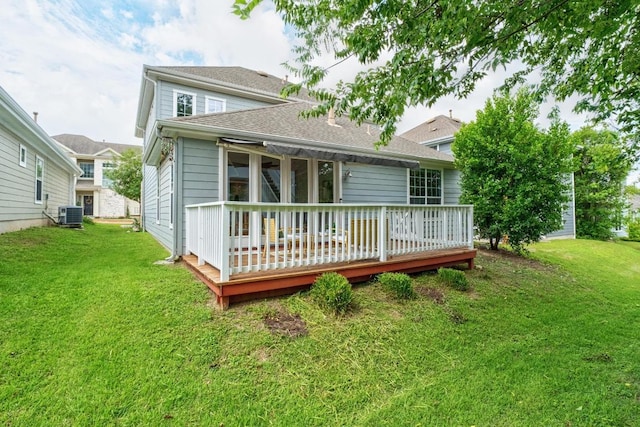 6715 Windrift Way Unit 29, Austin, TX 78745 - rear view of house featuring a wooden deck and a lawn