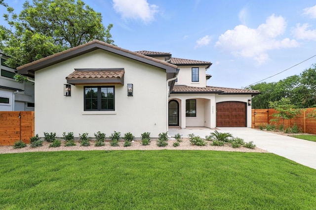 2007 Pasadena Dr, Austin, TX 78757 - mediterranean / spanish-style home with stucco siding, a tile roof, concrete driveway, and a garage