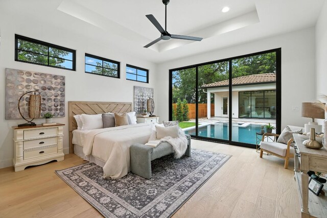 2007 Pasadena Dr, Austin, TX 78757 - bedroom with access to outside, light wood-style flooring, a raised ceiling, recessed lighting, and a ceiling fan