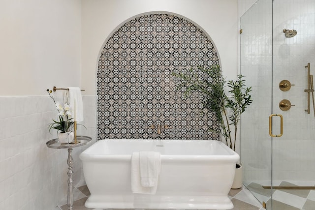 2007 Pasadena Dr, Austin, TX 78757 - bathroom with tile walls, a freestanding bath, and a shower stall