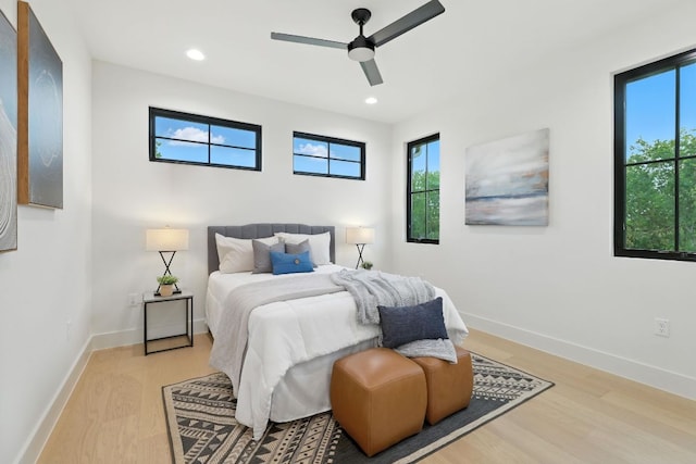 2007 Pasadena Dr, Austin, TX 78757 - bedroom featuring light wood-type flooring, multiple windows, recessed lighting, and ceiling fan