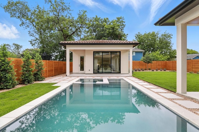 2007 Pasadena Dr, Austin, TX 78757 - rear view of property featuring a fenced backyard, stucco siding, a tiled roof, a pool with connected hot tub, and a patio