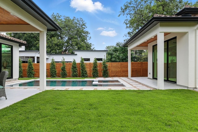 2007 Pasadena Dr, Austin, TX 78757 - view of yard featuring a patio and an in-ground hot tub