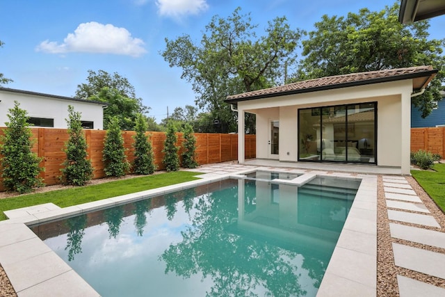 2007 Pasadena Dr, Austin, TX 78757 - view of swimming pool with a fenced backyard, a pool with connected hot tub, and an outdoor structure