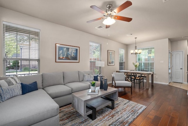 11000 Anderson Mill Rd Unit 52, Austin, TX 78750 - living area featuring wood finished floors, a ceiling fan, and a chandelier