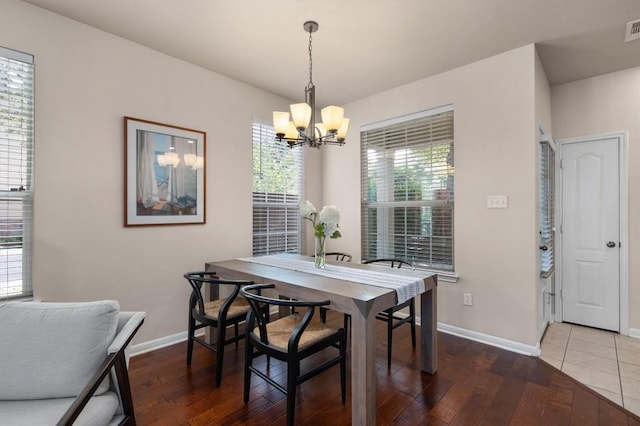 11000 Anderson Mill Rd Unit 52, Austin, TX 78750 - dining area with a chandelier, plenty of natural light, and wood finished floors