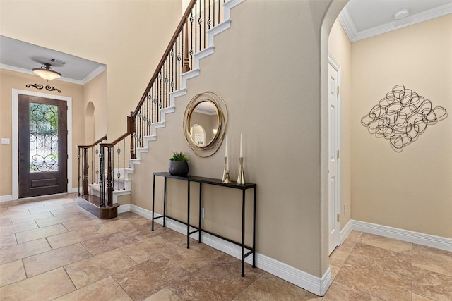1343 River Forest Dr, Round Rock, TX 78665 - foyer entrance with arched walkways, crown molding, stairway, and stone finish floors