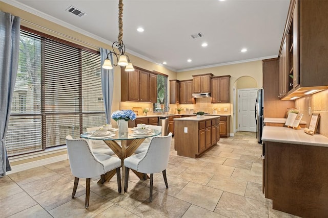 1343 River Forest Dr, Round Rock, TX 78665 - dining area with crown molding, plenty of natural light, and recessed lighting