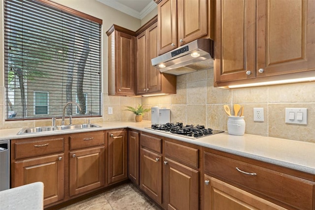 1343 River Forest Dr, Round Rock, TX 78665 - kitchen with under cabinet range hood, gas cooktop, decorative backsplash, crown molding, and light countertops