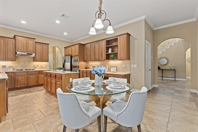 1343 River Forest Dr, Round Rock, TX 78665 - dining area with arched walkways, ornamental molding, and recessed lighting