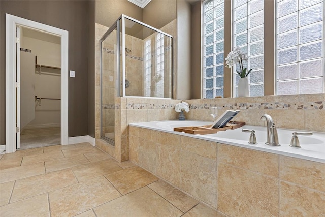 1343 River Forest Dr, Round Rock, TX 78665 - full bathroom featuring a stall shower, a garden tub, and a spacious closet