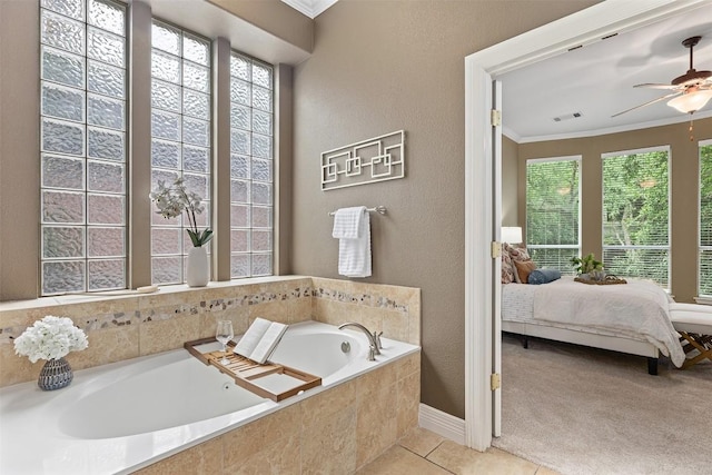 1343 River Forest Dr, Round Rock, TX 78665 - ensuite bathroom featuring a bath, ornamental molding, a ceiling fan, and tile patterned floors