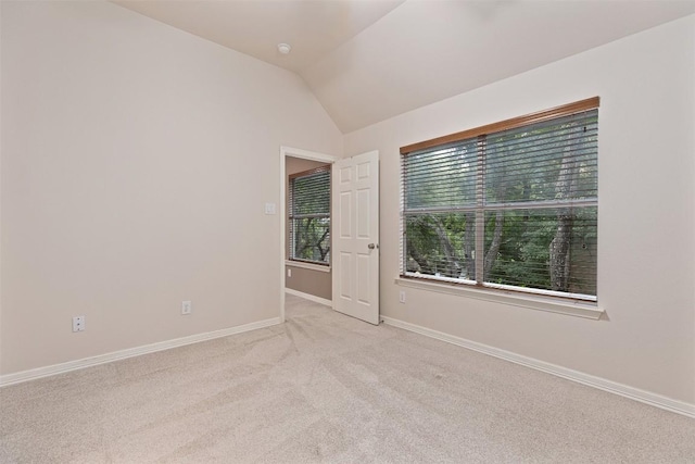 1343 River Forest Dr, Round Rock, TX 78665 - spare room featuring vaulted ceiling and light colored carpet