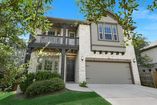9516 Hunter Ln, Austin, TX 78748 - view of front of home with a balcony, driveway, and an attached garage