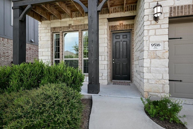 9516 Hunter Ln, Austin, TX 78748 - entrance to property featuring stone siding, brick siding, and a garage
