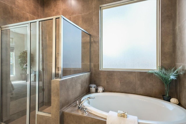 9516 Hunter Ln, Austin, TX 78748 - full bath with a bath, a shower stall, and tile walls