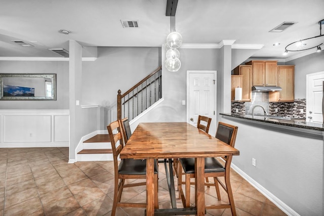 8518 Cahill Dr Unit 23, Austin, TX 78729 - dining space with crown molding, stairway, and light tile patterned floors
