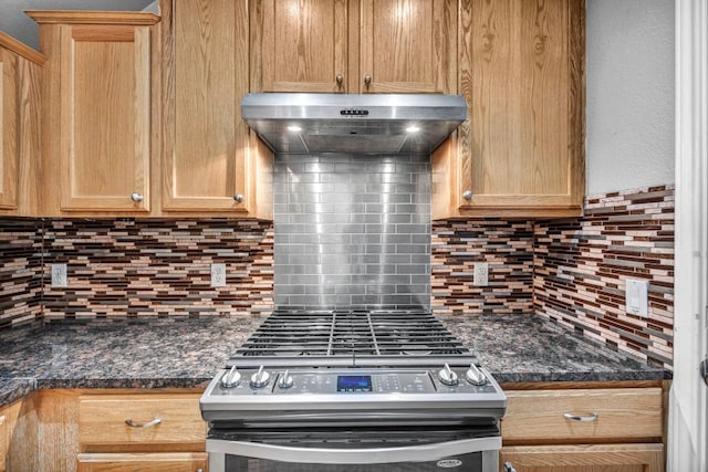 8518 Cahill Dr Unit 23, Austin, TX 78729 - kitchen with exhaust hood, stainless steel gas range, dark countertops, and backsplash