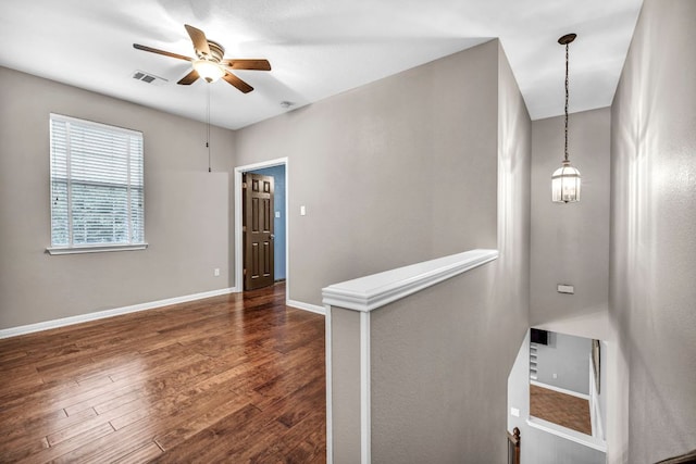 8518 Cahill Dr Unit 23, Austin, TX 78729 - empty room with ceiling fan and dark wood-type flooring