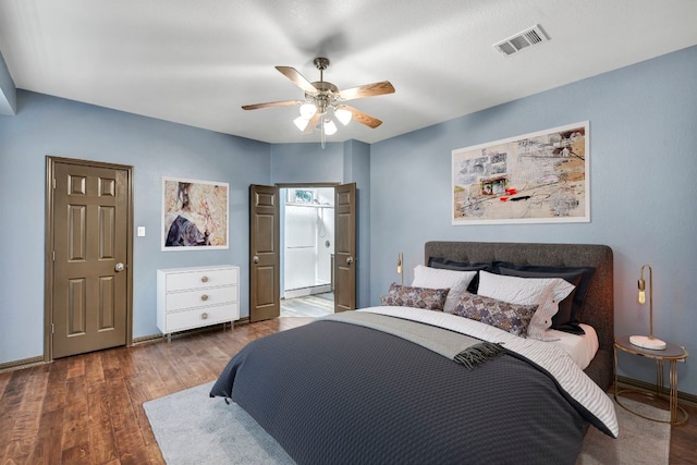 8518 Cahill Dr Unit 23, Austin, TX 78729 - bedroom with wood finished floors and a ceiling fan