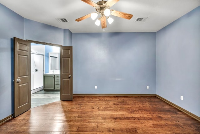 8518 Cahill Dr Unit 23, Austin, TX 78729 - unfurnished room with ceiling fan and wood finished floors