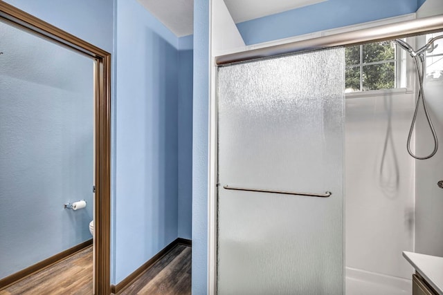 8518 Cahill Dr Unit 23, Austin, TX 78729 - full bathroom with wood finished floors, a stall shower, and vanity
