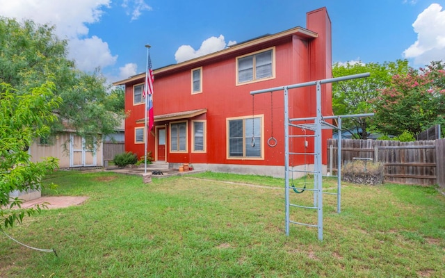 5605 China Berry Rd, Austin, TX 78744 - rear view of house featuring a fenced backyard and a chimney