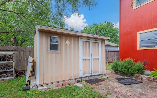 5605 China Berry Rd, Austin, TX 78744 - view of shed with a fenced backyard