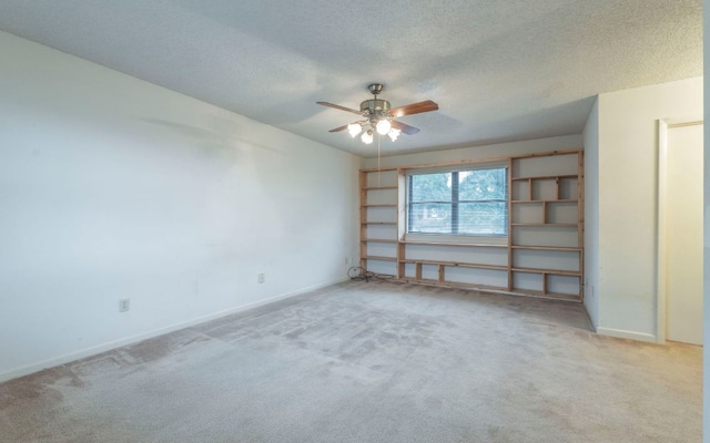 5605 China Berry Rd, Austin, TX 78744 - carpeted empty room with a ceiling fan and a textured ceiling