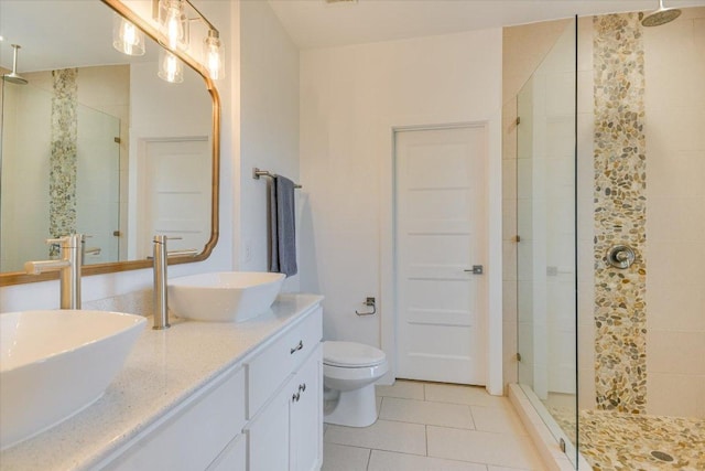 3009 Lawrence Dr, Austin, TX 78734 - bathroom featuring tile patterned floors, a shower stall, and double vanity