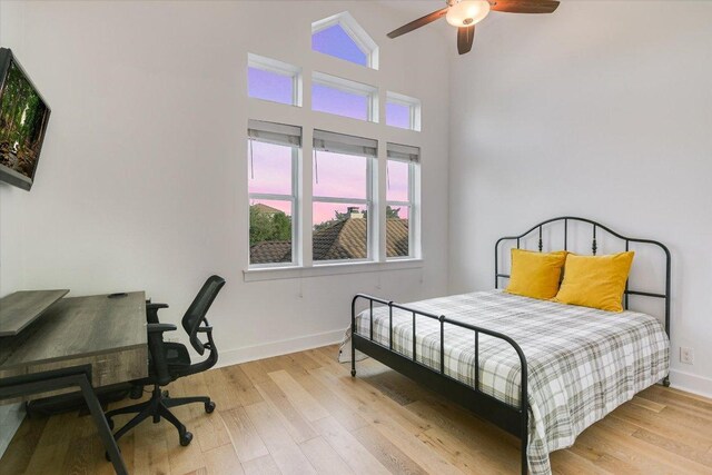 3009 Lawrence Dr, Austin, TX 78734 - bedroom featuring wood finished floors, a high ceiling, and ceiling fan