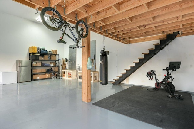3009 Lawrence Dr, Austin, TX 78734 - below grade area with freestanding refrigerator and stairway