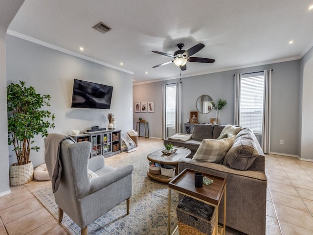 13320 Gilwell Dr, Del Valle, TX 78617 - living area featuring healthy amount of natural light, light tile patterned floors, a ceiling fan, recessed lighting, and ornamental molding