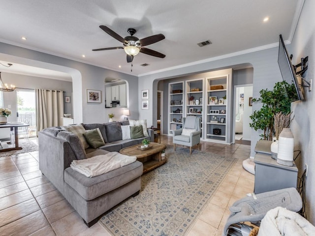 13320 Gilwell Dr, Del Valle, TX 78617 - living room with arched walkways, tile patterned floors, a ceiling fan, recessed lighting, and ornamental molding