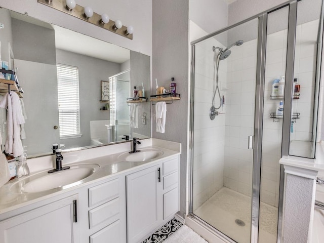 13320 Gilwell Dr, Del Valle, TX 78617 - bathroom featuring a stall shower and double vanity
