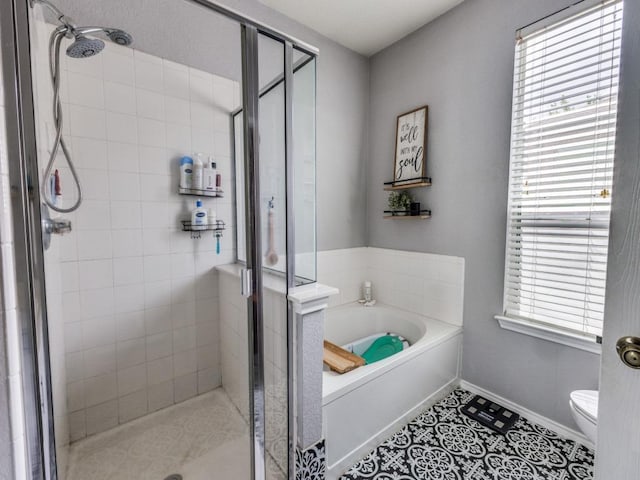 13320 Gilwell Dr, Del Valle, TX 78617 - bathroom with a garden tub, a stall shower, and tile patterned floors
